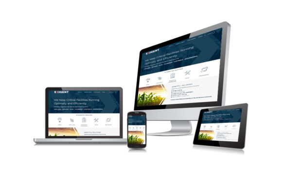 Exigent website mockup shown in a wlaptop, monitor, tablet and phone.